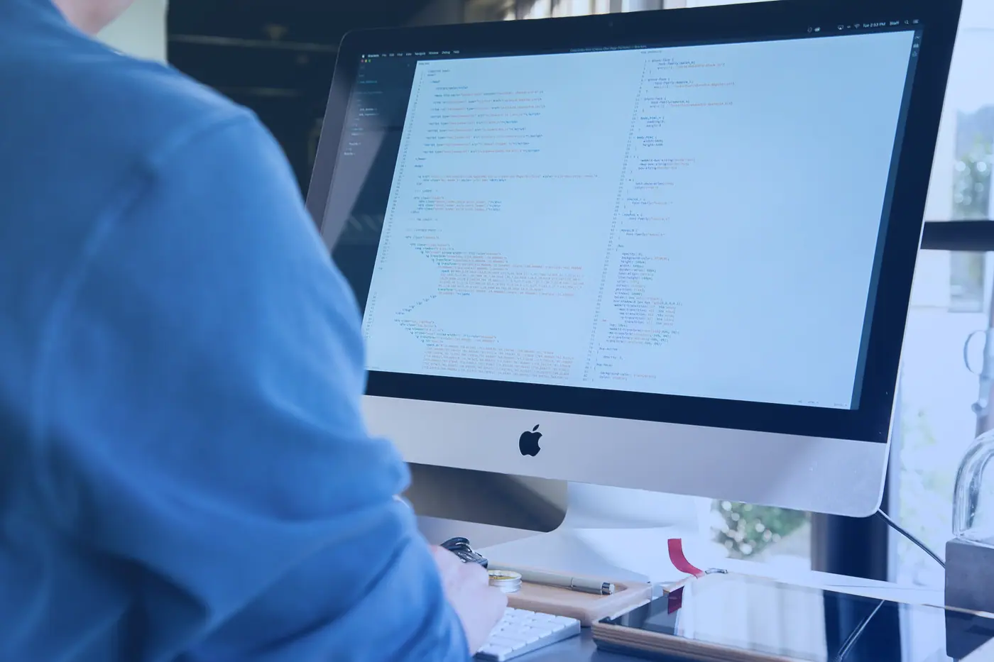 A developer working at a desktop computer