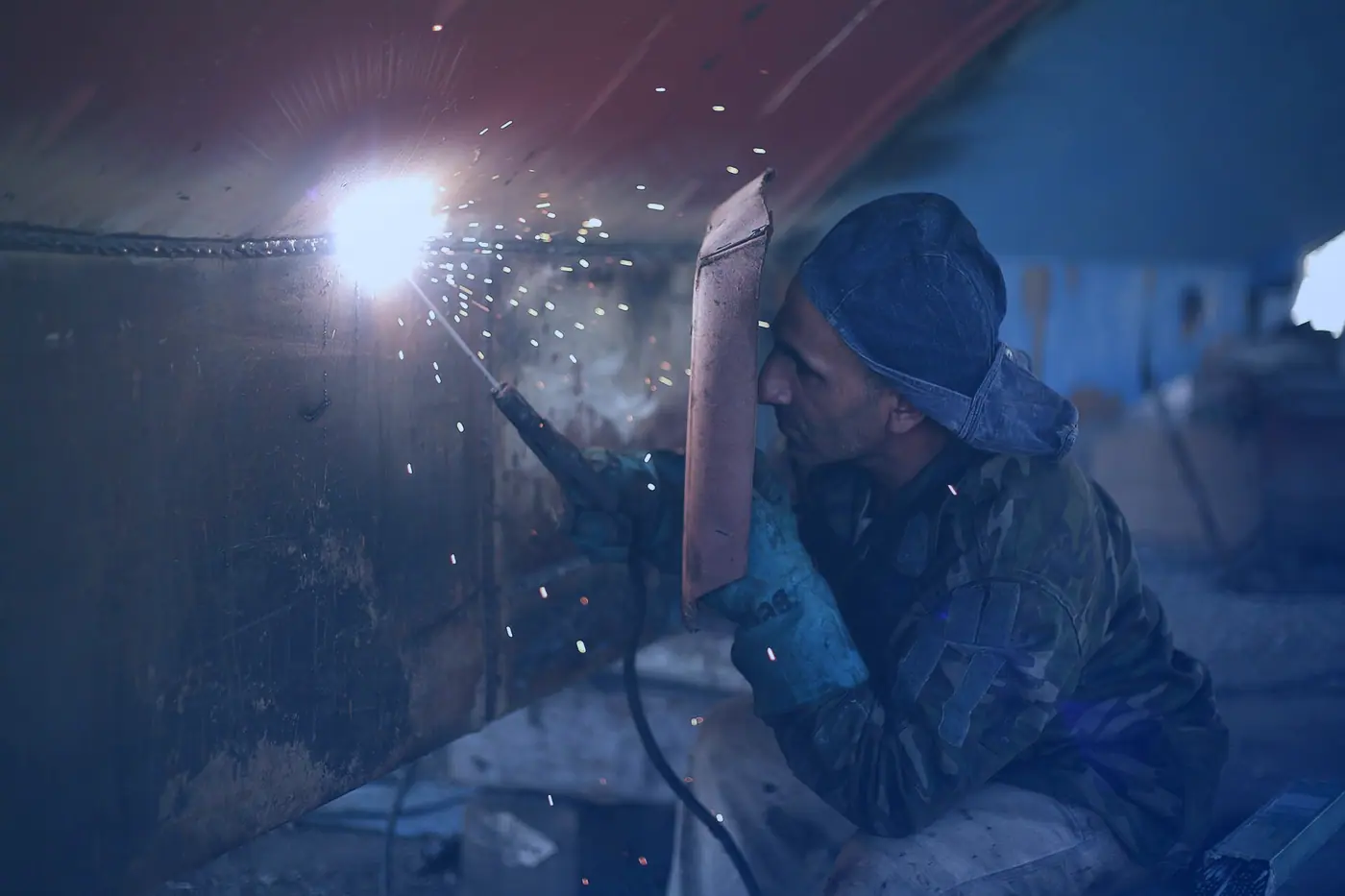 A welder at work in a workshop